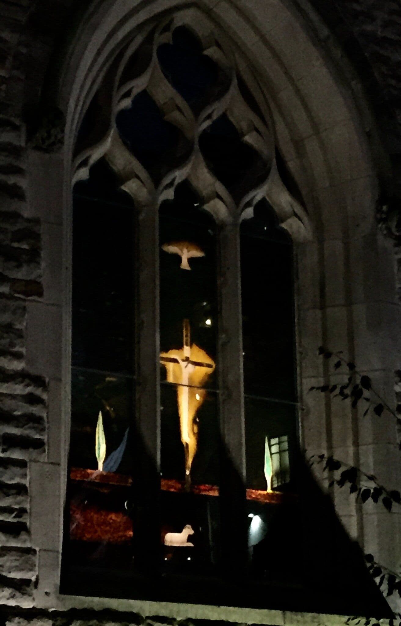 Craigie Aitchison’s completed chapel window illuminated inside St Martin in the Bull Ring